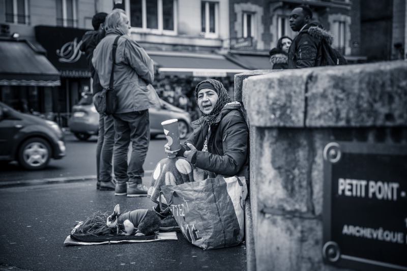 a woman asking for money on the street